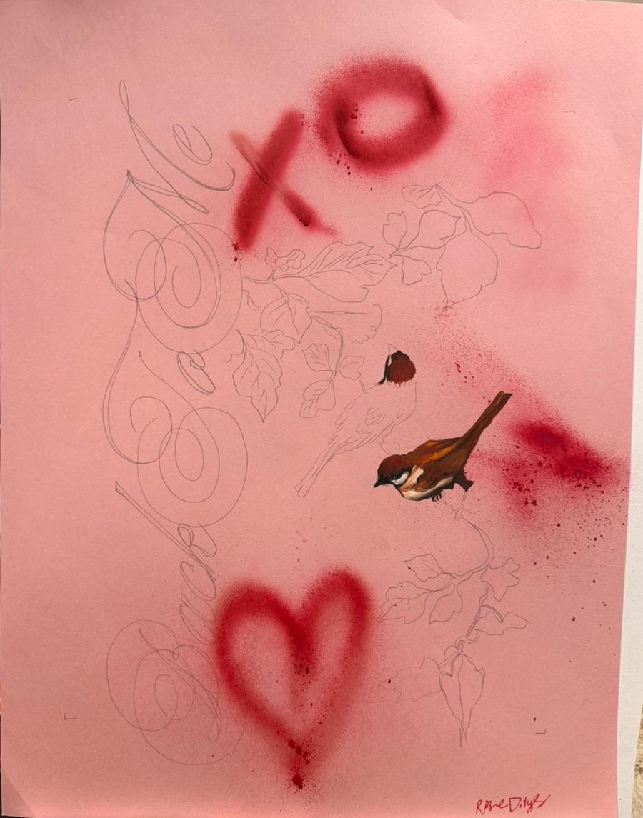 Work in progress on an easel: a painted sparrow among pencil-drawn leaves and lettering on pink paper, with a sprayed heart, signed Rosie Dilys
